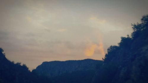 Scenic view of landscape against sky at sunset