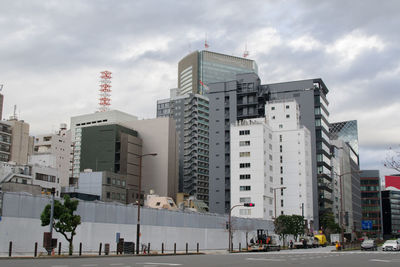 Buildings in city against sky