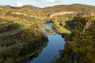 Scenic view of berounka river and limestone rock formations in tetín, czech republic in autumn 