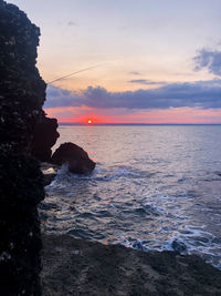 Scenic view of sea against sky during sunset