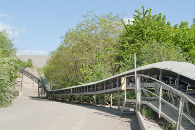 Bridge over road against sky