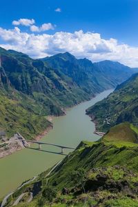 High angle view of road amidst mountains against sky