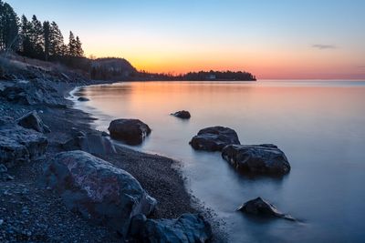 Scenic view of sea against sky during sunset