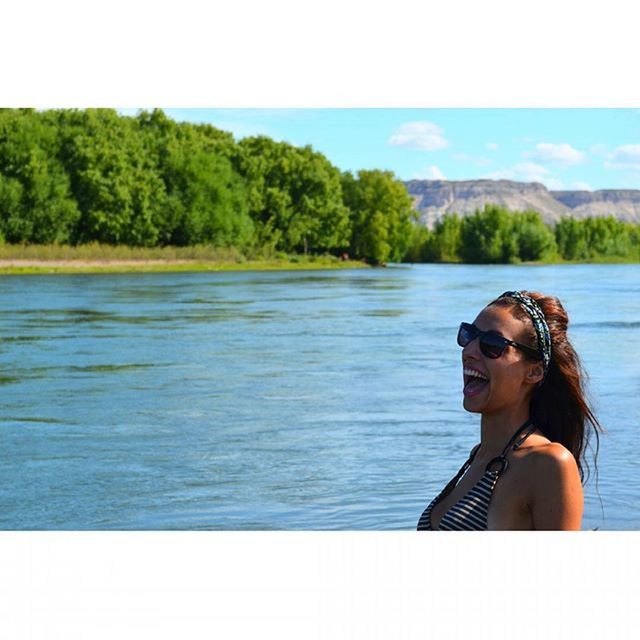 water, lifestyles, leisure activity, young adult, tree, lake, person, clear sky, young women, nature, auto post production filter, transfer print, sea, side view, beauty in nature, day, tranquility, rippled