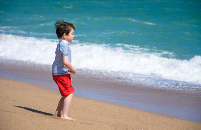 Full length of boy on beach