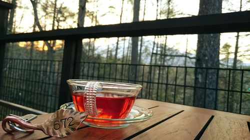 Close-up of drink on table in balcony