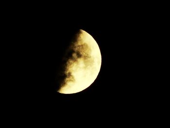 Low angle view of moon against sky at night