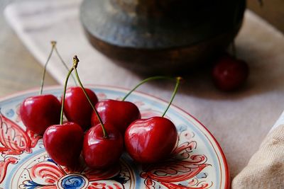 High angle view of cherries in bowl on table