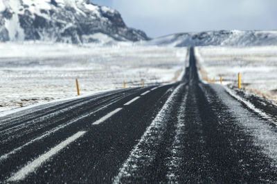 Wet and slippery road in iceland, winter