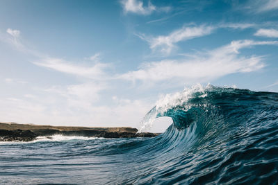 Sea waves against sky