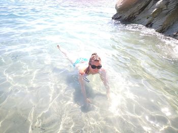 High angle view of man swimming in sea