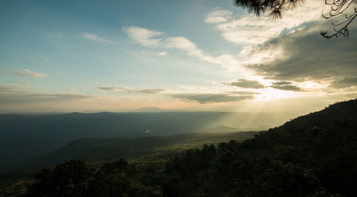 Scenic view of silhouette mountains against sky at sunset