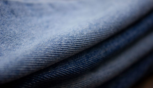 A stack of denim. color denim close-up texture