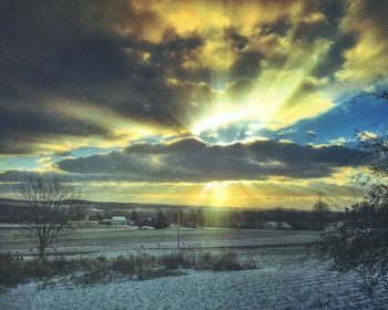 Scenic view of landscape against cloudy sky