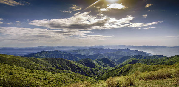 Looking down at the beautiful green mountains in the distance from a high place