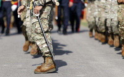 Low section of soldiers marching on road