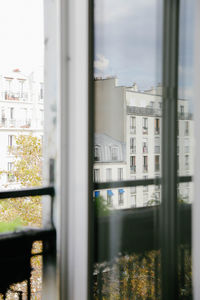 Buildings seen through glass window