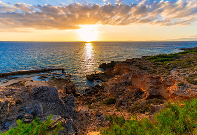 Scenic view of sea against sky during sunset