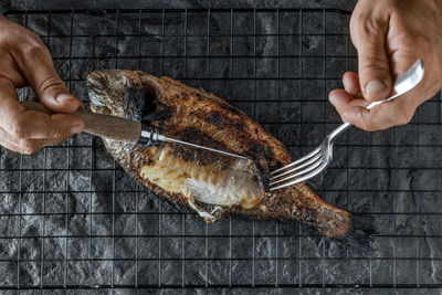 Cropped hand of person preparing food