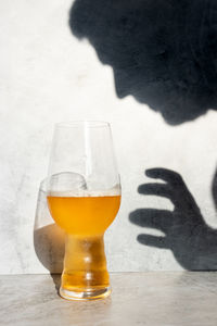 Close-up of beer glass on table