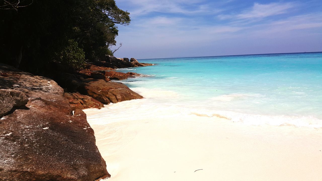 sea, water, beach, sky, tranquil scene, tranquility, scenics, horizon over water, shore, beauty in nature, nature, rock - object, tree, sand, idyllic, cloud - sky, coastline, cloud, calm, outdoors