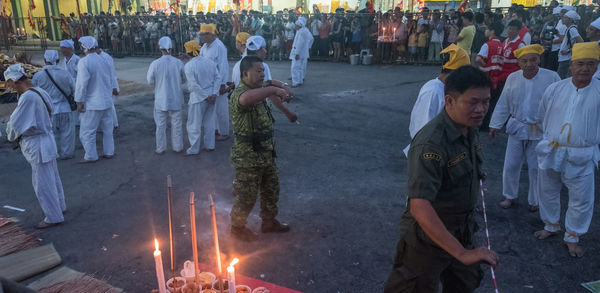 People in front of bonfire