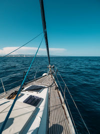 View from yacht prow heading in mediterranean sea with deep blue water in summer, barcelona, spain