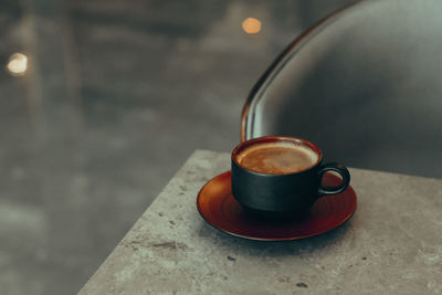 High angle view of coffee cup on table