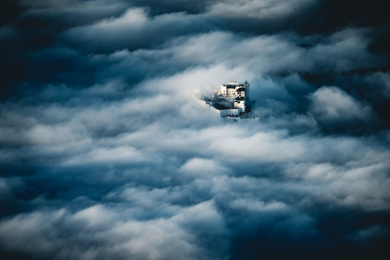 cloud, sky, transportation, air vehicle, flying, vehicle, nature, mode of transportation, airplane, mid-air, aircraft, cloudscape, no people, outdoors, day, storm, overcast, aviation, motion, screenshot, storm cloud, wing, dramatic sky, darkness, technology