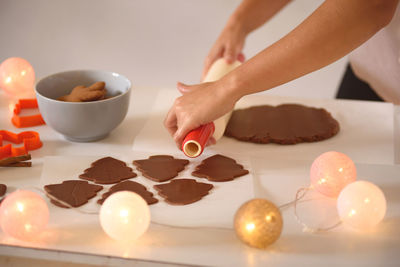 Midsection of woman preparing food on table