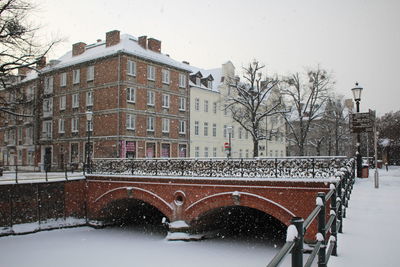 View of buildings in city during winter