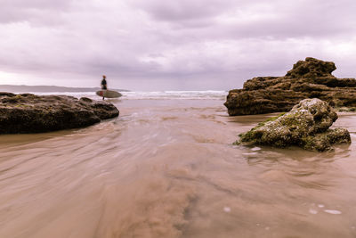 Scenic view of sea against cloudy sky