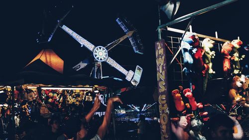 Toys for sale at amusement park at night