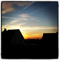 Silhouette of buildings at sunset