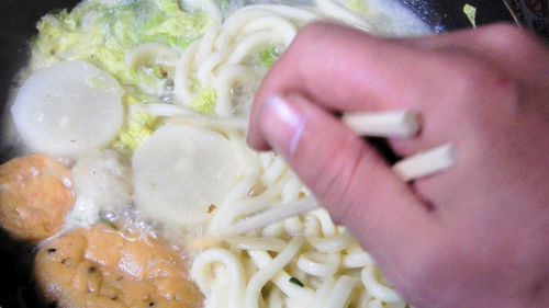 Close-up of hand holding food