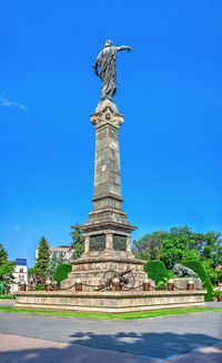 View of statue against blue sky