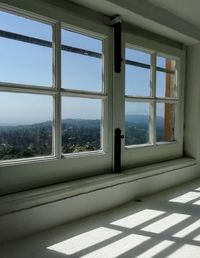 View of sea seen through window