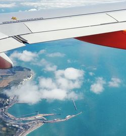 Aerial view of airplane flying in sky