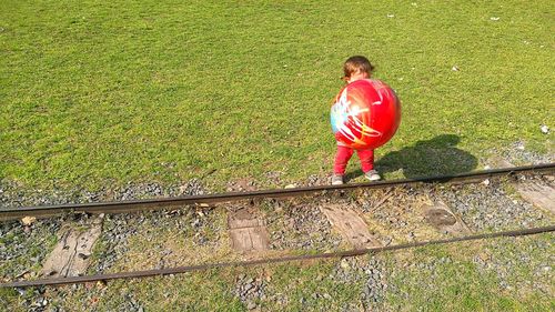 Full length of woman standing on grass