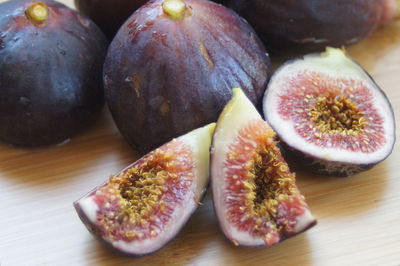 High angle view of figs on wooden table