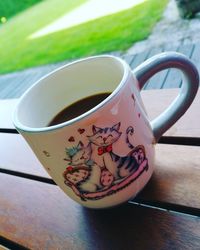 Close-up of coffee cup on table