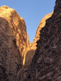 Low angle view of rock formation against sky