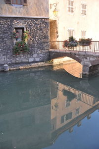 Reflection of built structure in swimming pool