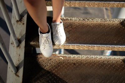 Low section of woman standing on floor