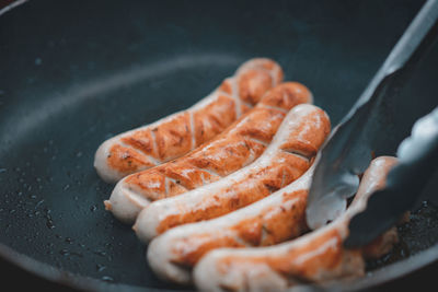 High angle view of meat on barbecue grill