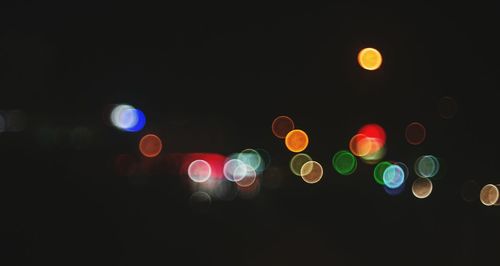 Close-up of colorful lights against black background