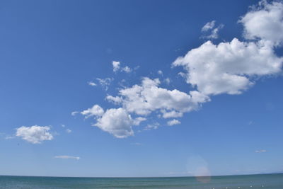 Scenic view of sea against cloudy sky