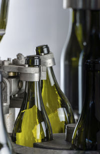 Close-up of wine bottles in container