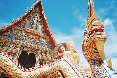 Low angle view of temple and building against sky