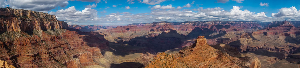 Panoramic view of landscape with mountain range in background